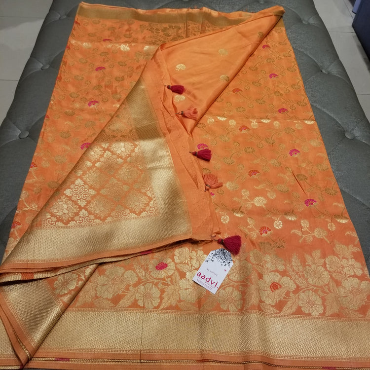 Pastel Peach Color Crepe Marble Silk Handwoven Sari with intricate golden floral all-over work