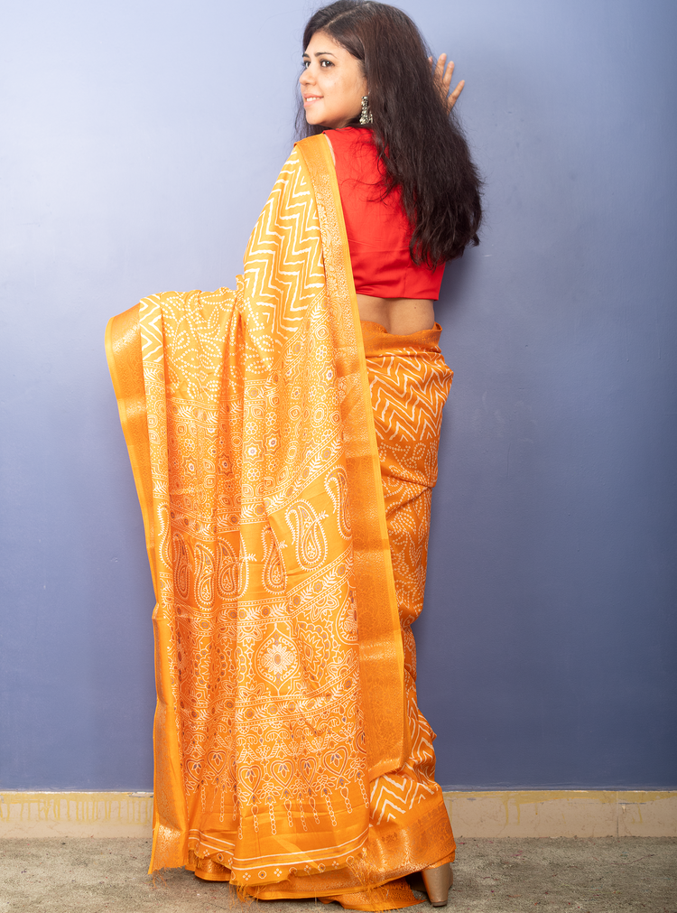 Tangerine Yellow Bandhni Printed Crepe Silk Sari